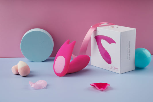 Pink wearable vibrator beside its Eidolon retail box.
