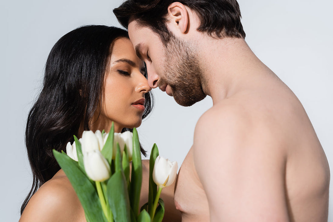 Couple embracing with white tulips.