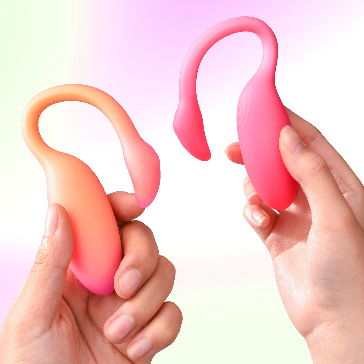 Two Magic Motion Flamingo Max sensing vibrators held in hands.