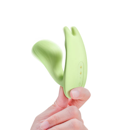 Hand holding the Magic Umi Green wearable vibrator