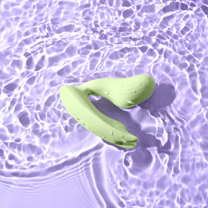 Magic Umi Green wearable vibrator shown in water for IPX6 water resistance