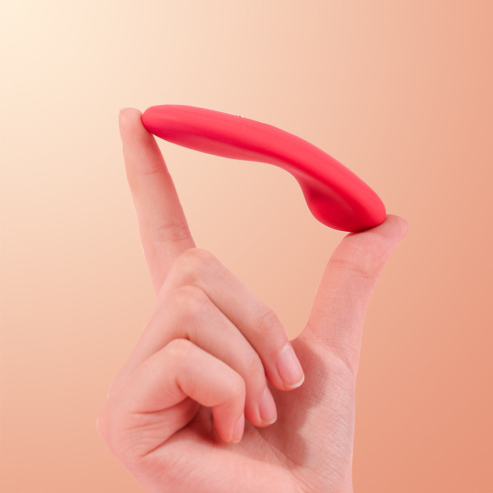 Hand holding Magic Nyx slim external wearable vibrator