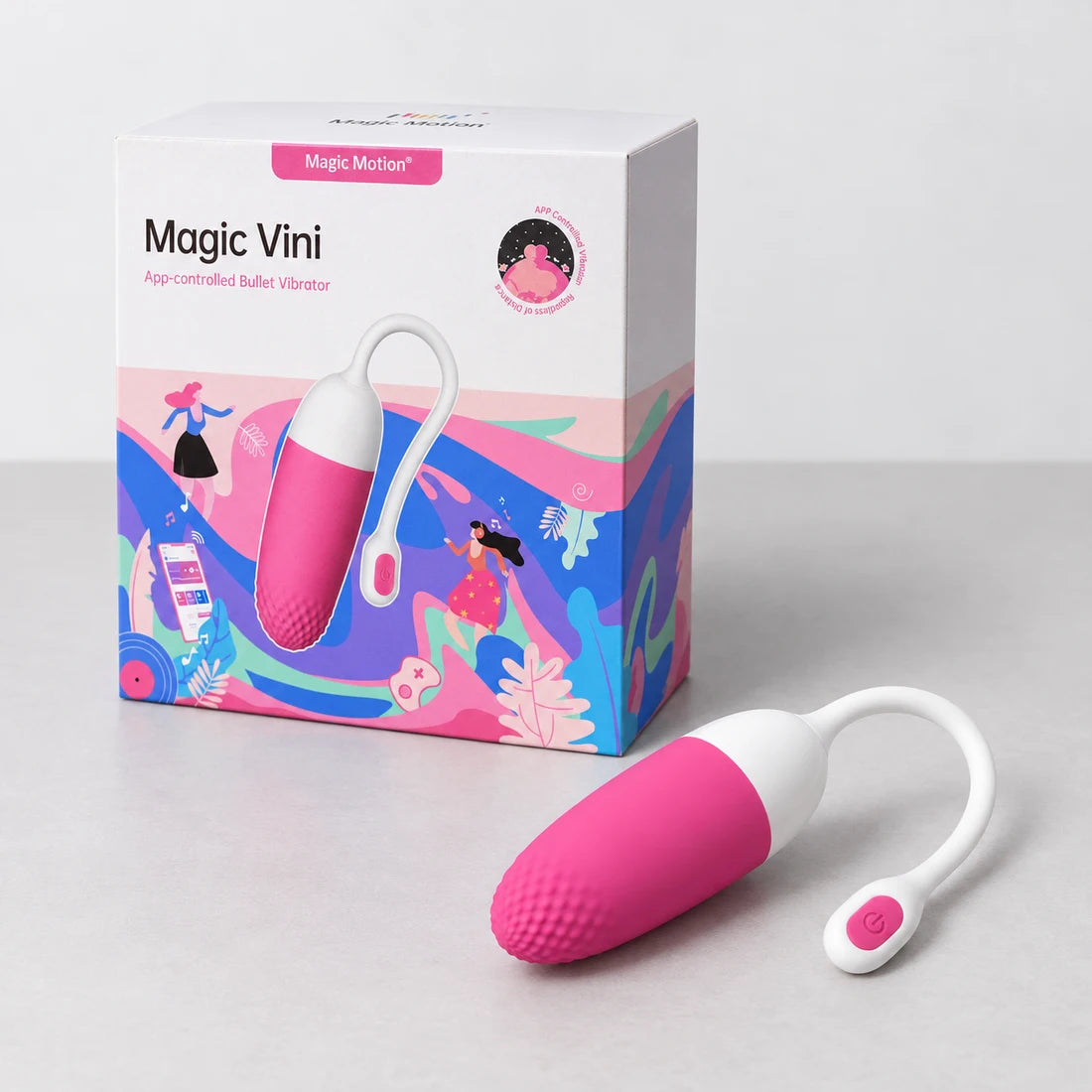 Pink and white Magic Vini lying beside its illustrated retail box